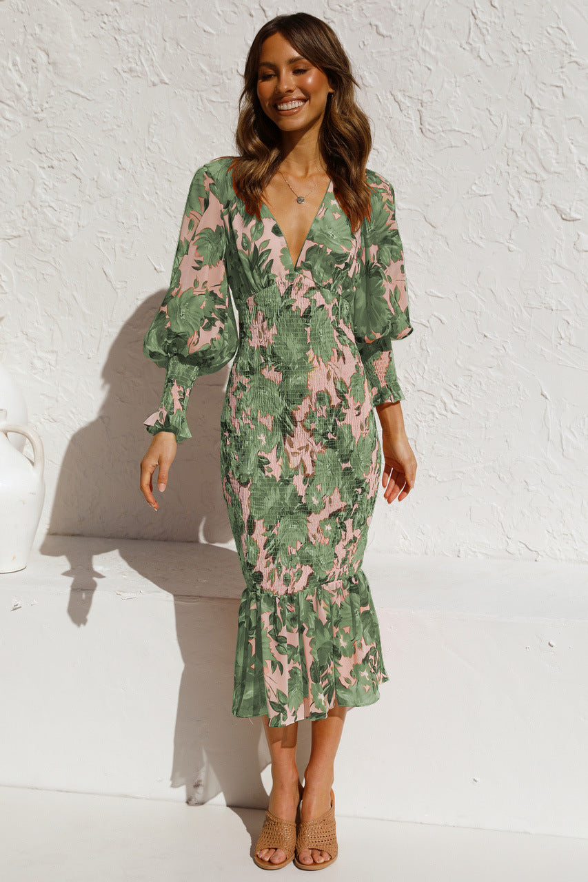 Alma – Elegant midikjole med blomsterprint med lange ærmer med V hals Lundbutik